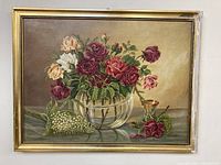 Full view of the framed floral painting showing bouquet in glass container with gold frame.