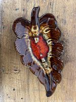 Top view of vintage ceramic leaf-shaped ashtray showing full shape and glaze colors