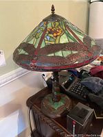 Overall view of lamp on side table showing shade and base