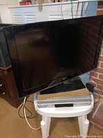 32 inch LG flat-screen TV turned off, visible front and screen.