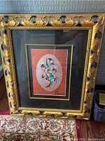 Full view of the framed serigraph showing vibrant abstract design and ornate gold-black frame.