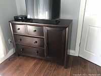 Chocolate brown dresser with 4 drawers and a closed side cabinet door, shown from the front left angle.