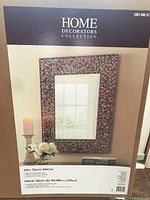 Photo of the packaged mirror box showing brand and size details.