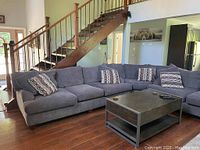 Full three-piece sectional configuration with throw pillows