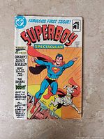 Front cover showing Superboy flying with Krypto the Superdog and comic title.