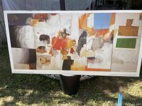 Full view of the large abstract mounted print with artist and gallery name visible, held outdoors showing overall condition.