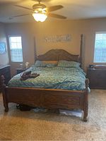 Full frontal view of the bed frame showing the headboard, footboard, side rails, and mattress for scale.