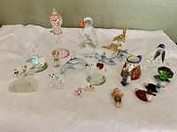 Collection of 21 miniatures arranged on a flat surface displaying variety in size and color