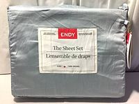 Front label of folded and packaged ENDY sheet set showing brand, size, and product line.
