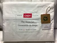Front packaging label of ENDY The Sheet Set in alpine white color for Cal King size, showing 300 thread count 100% organic cotton and GOTS certification tag.