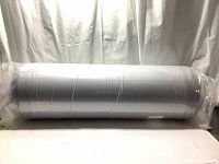 View of the rolled and vacuum-sealed mattress in plastic packaging showing the factory sealed condition.