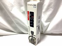 Front view of the boxed Joby GorillaPod 500 Action flexible tripod with a window revealing the tripod inside and packaging visuals showing tripod in use with a GoPro type camera.