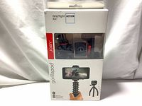 Front of product retail box showing the Joby GorillaPod GripTight Action Kit branding and images of the tripod with smartphone.
