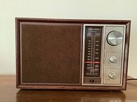Front view of the vintage Realistic MTA 12-690B radio showing speaker grille and tuning controls.
