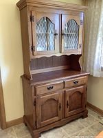 Full view of the vintage wood china cabinet hutch buffet showing both upper and lower sections, doors, drawers, and open shelf area.