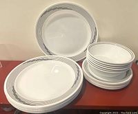 View of the assembled plates and bowls showing overall pattern and quantity.