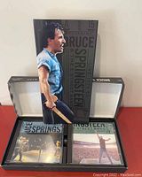 Box open displaying 3 CDs and booklet inside