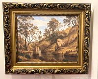 Front view of the framed giclee print showing a landscape scene with hills, trees, water, and figures.