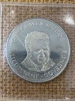 Front side of the coin with raised portrait of John Graves Simcoe, labeled Lieutenant Governor.