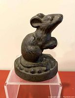 Front view of the vintage cast iron mouse door stop showing mouse details and base.