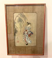 Full framed woodblock print showing the woman under a willow branch, framed with textured mat and wooden frame.