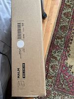 Box side view showing IKEA MALM label and product number 802.145.49 with size specifications (40x55 cm).