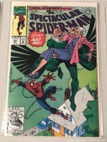 Photo of Marvel Spectacular Spider-Man comic book issue #187 titled 'Funeral Arrangements Part Two' with cover art showing Spider-Man and Aunt May and house below.