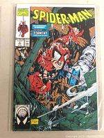 Front cover of Marvel Spider-Man comic book issue 'Torment' part 5 of 5 with cover art showing Spider-Man in a damaged suit in a distressed scene.