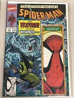 Photo of Marvel Spider-Man comic book issue #11, Perceptions Part 4 of 5, featuring Wolverine and Wendigo on cover.