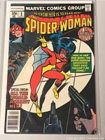 Front cover photo of Marvel Spider-Woman comic book issue number 1, showing the character in action and cover art details.