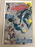 Front cover photo of The Amazing Spider-Man comic book issue 265 showing Spider-Man in black suit and multiple villains labeled 'The Fox' in a dock setting.