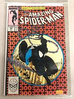 Front cover showcasing black-suited Spider-Man swinging against repeating ‘300’ background and anniversary banner