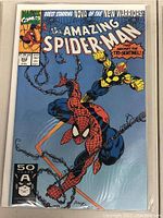 Front cover of The Amazing Spider-Man issue 352 comic book showing Spider-Man and Nova fighting with comic details, Marvel logo, issue number and price visible.