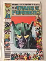 Front cover of Marvel Transformers comic book issue 22 showing colorful illustrated face of a Transformer and various characters on borders.