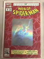 Comic book cover showing Marvel Web of Spider-Man 30th Anniversary issue #90 with holographic insert and spider web design.