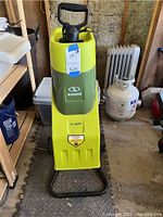 Front view of Sun Joe electric wood chipper showing brand name, 15-amp motor sticker, and overall condition.