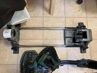 Full view of tactical sled with metal rods and vise on tiled floor