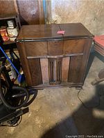Front view of the wooden vintage RCA Victrola stereo cabinet, showing overall design and cabinet condition.