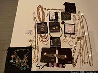 Full assortment of gold-tone and silver-tone jewelry laid out