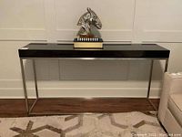 Front view of console table showing full length and placement against wall