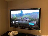 Front view of Panasonic 50” Viera TV powered on showing interface