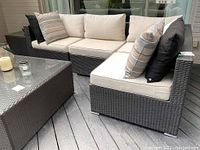 Angled front view of L-shaped sectional sofa and coffee table