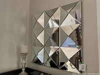 Front view of full square mirror showing all 16 mirrored panels
