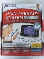 Box front showing Dr Ho's Pain Therapy System Pro device and benefits