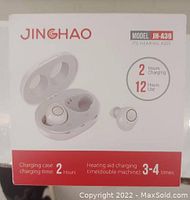 Photo of the Jinghao Model JH-A39 hearing aids packaging showing the product image, model number, usage times, and charging details.