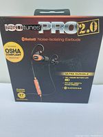 Front of boxed ISOTunes PRO 2.0 earbuds showing branding and product highlights like battery life, waterproof rating, and OSHA compliant noise protection.