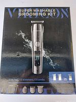 Front packaging of the Super Washable Grooming Kit showing the trimmer with digital display and attachments.