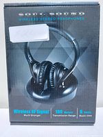 Front of the box showing wireless stereo headphones and key features such as wireless RF signal, 100 meters transmission range, and 6 hours music time