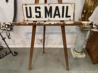 Front view of two-sided U.S. Mail sign mounted on easel