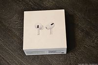 Front of Apple AirPods Pro box showing earbuds illustration